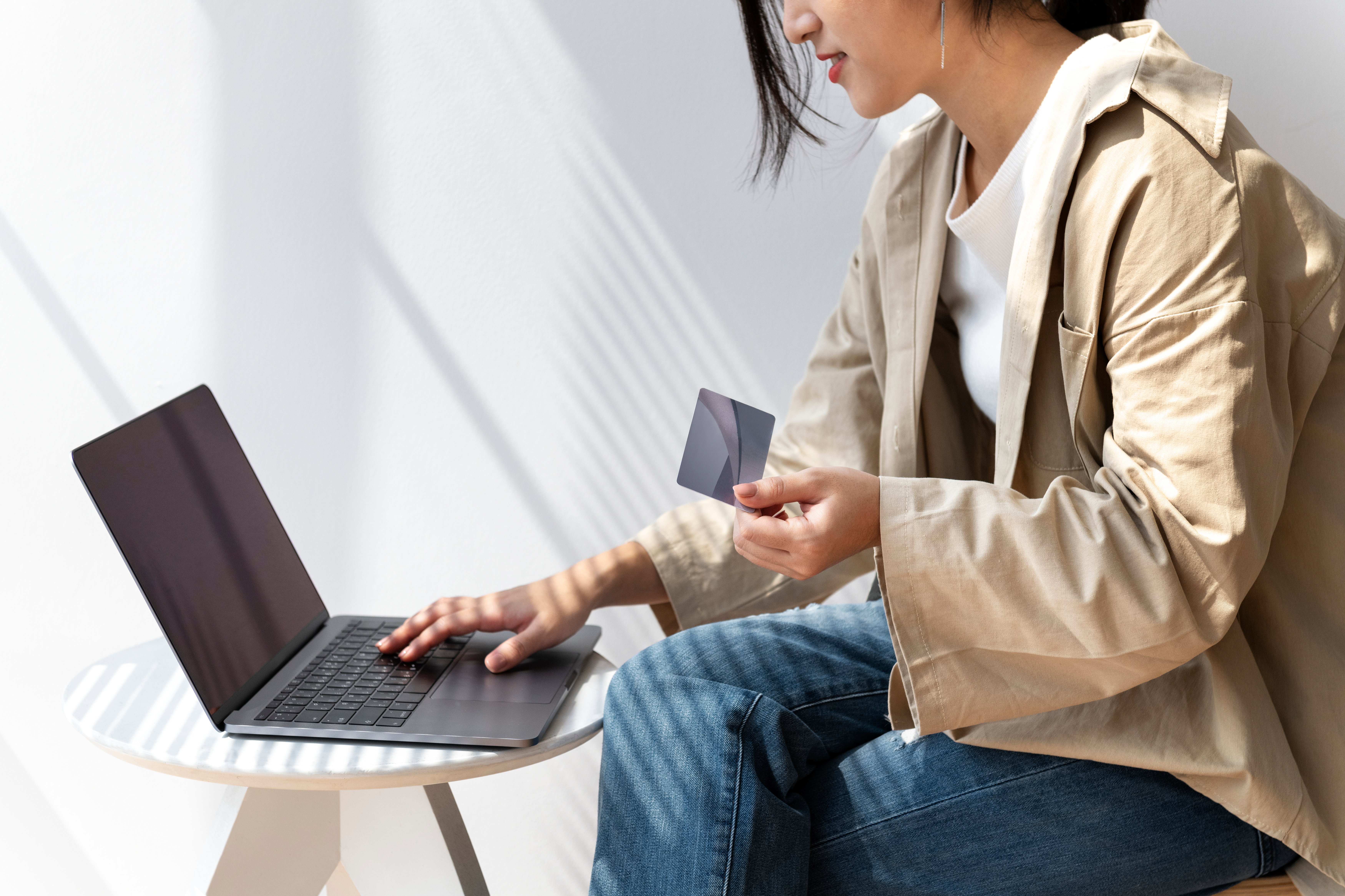 asian-woman-online-shopping-using-her-laptop