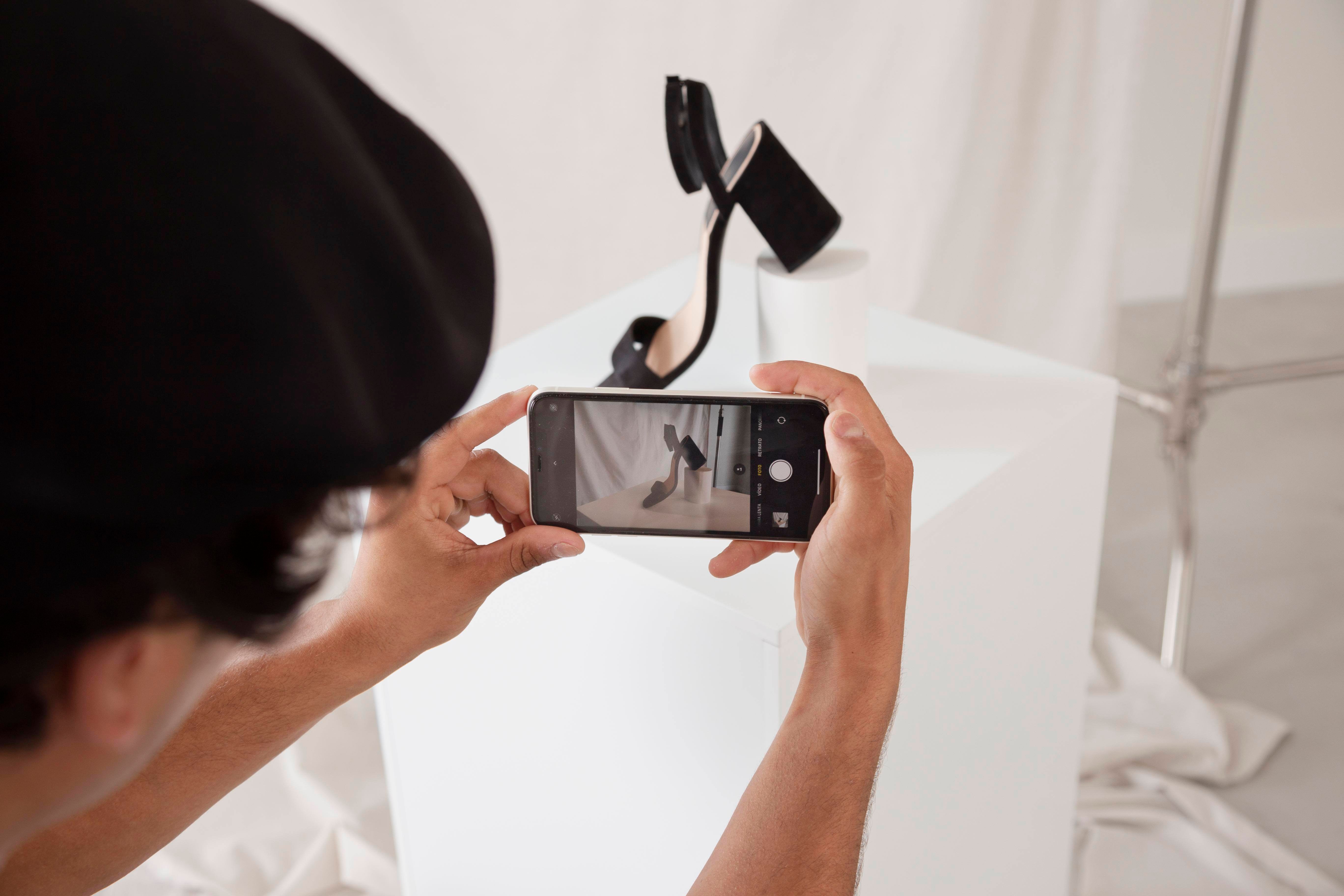 man-taking-photo-his-studio