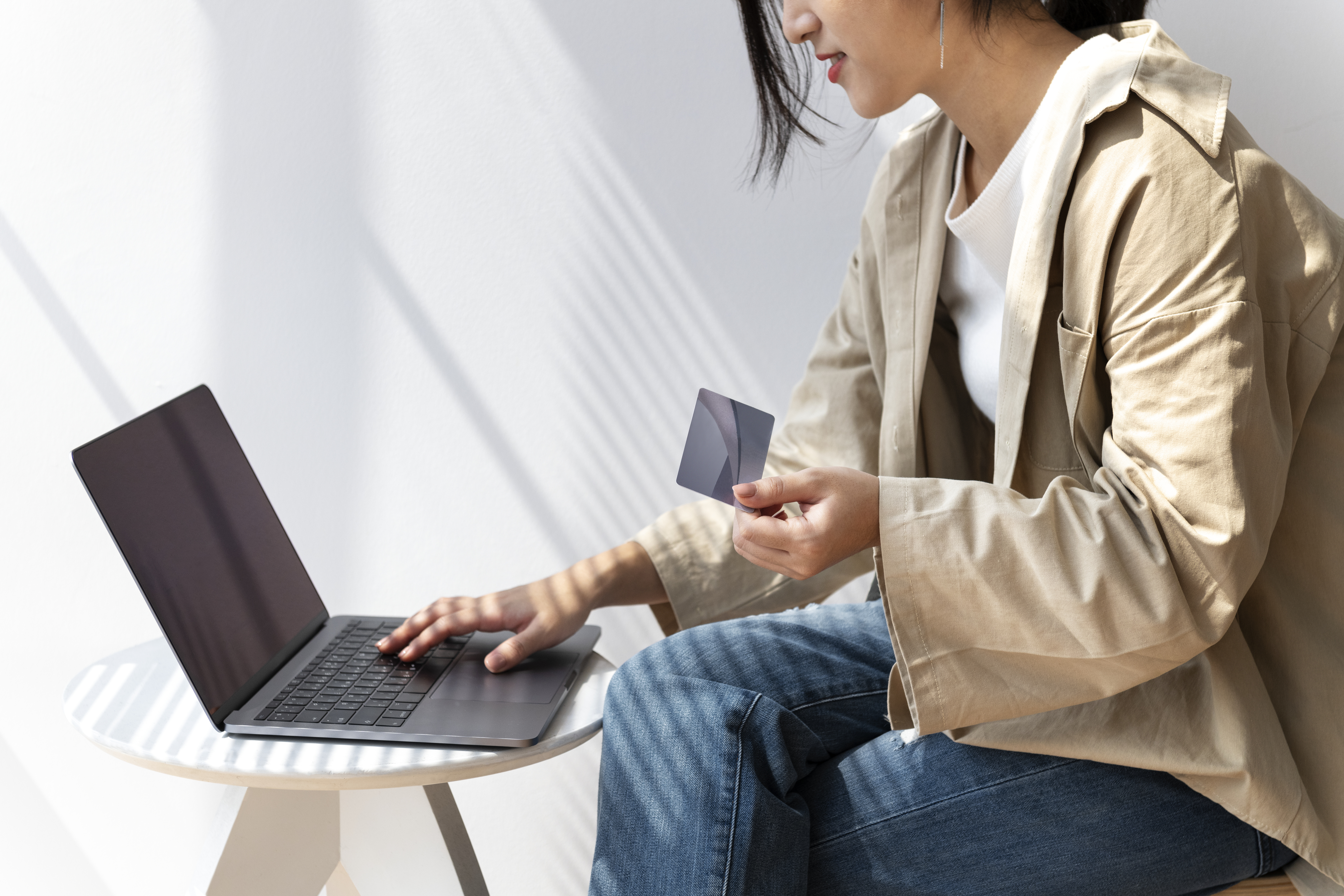 asian-woman-online-shopping-using-her-laptop