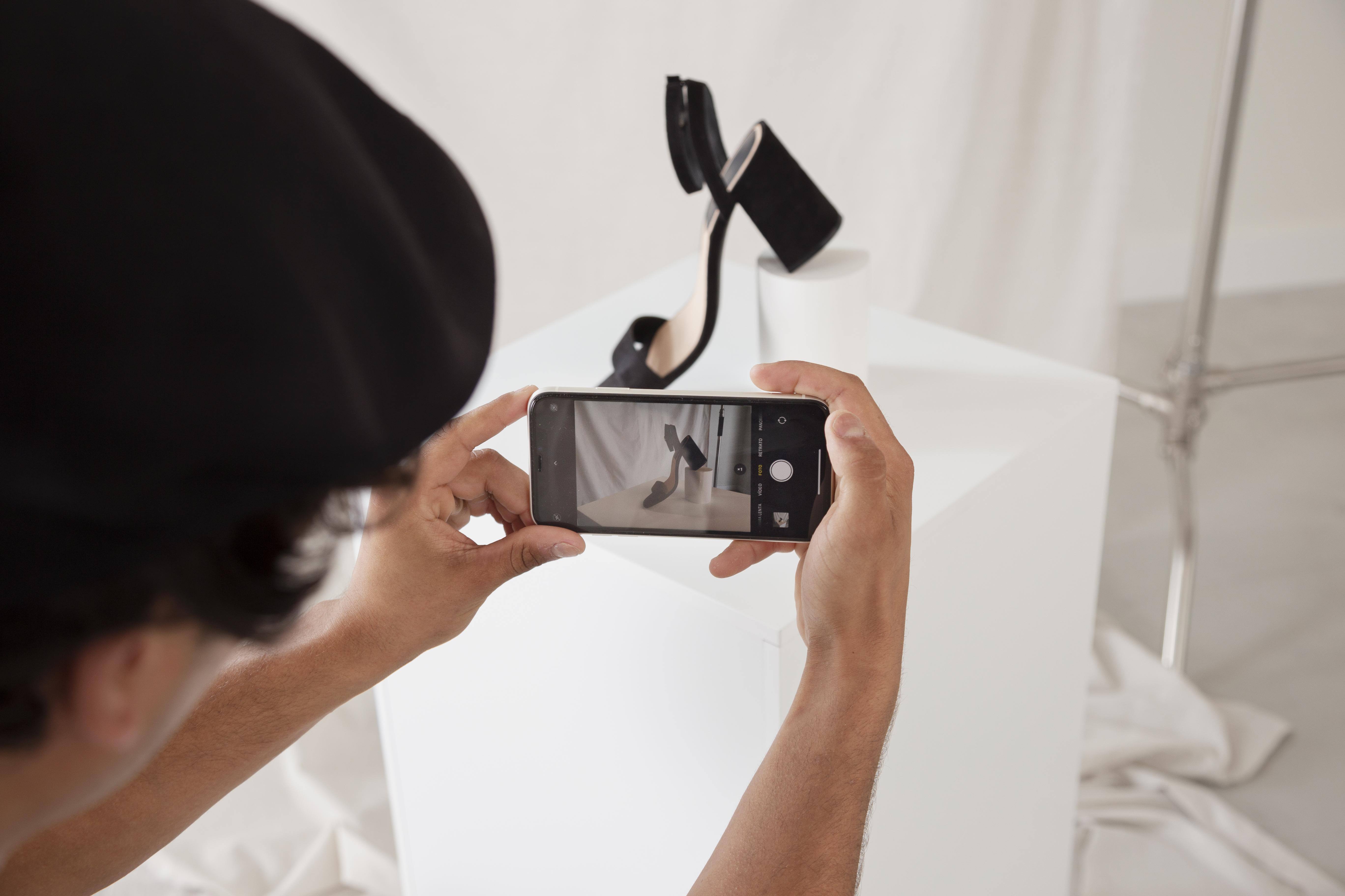 man-taking-photo-his-studio